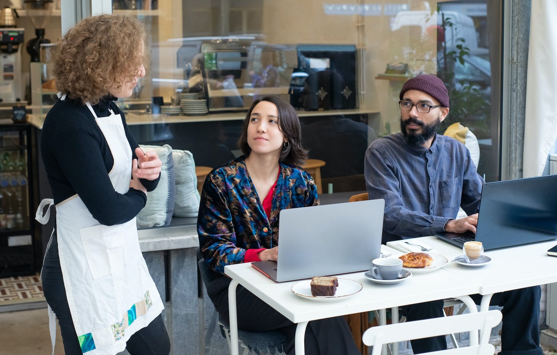 a waitress talking to customers